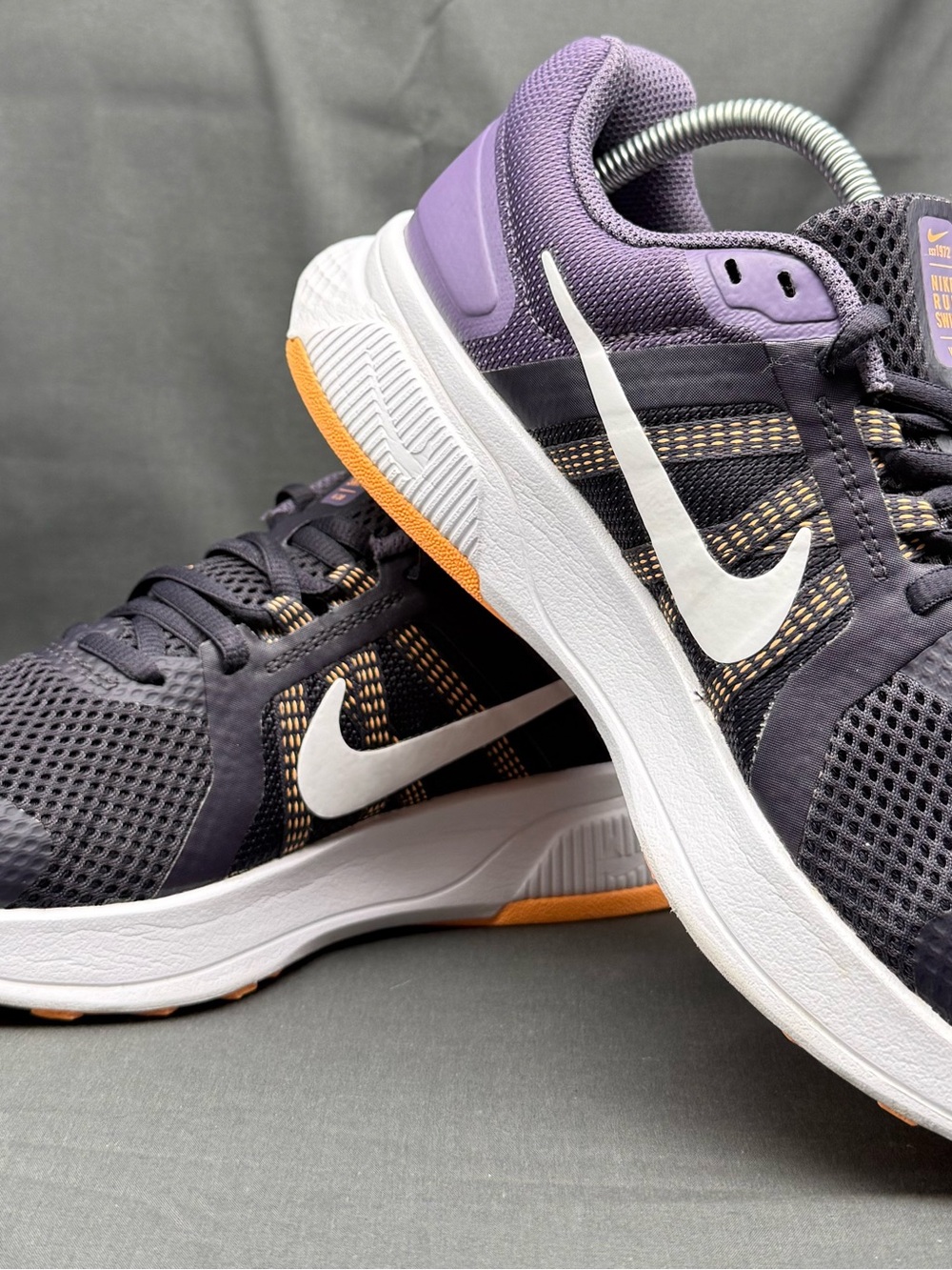 Nike Women’s Purple and White Running Shoes and orange/white soles white swoosh